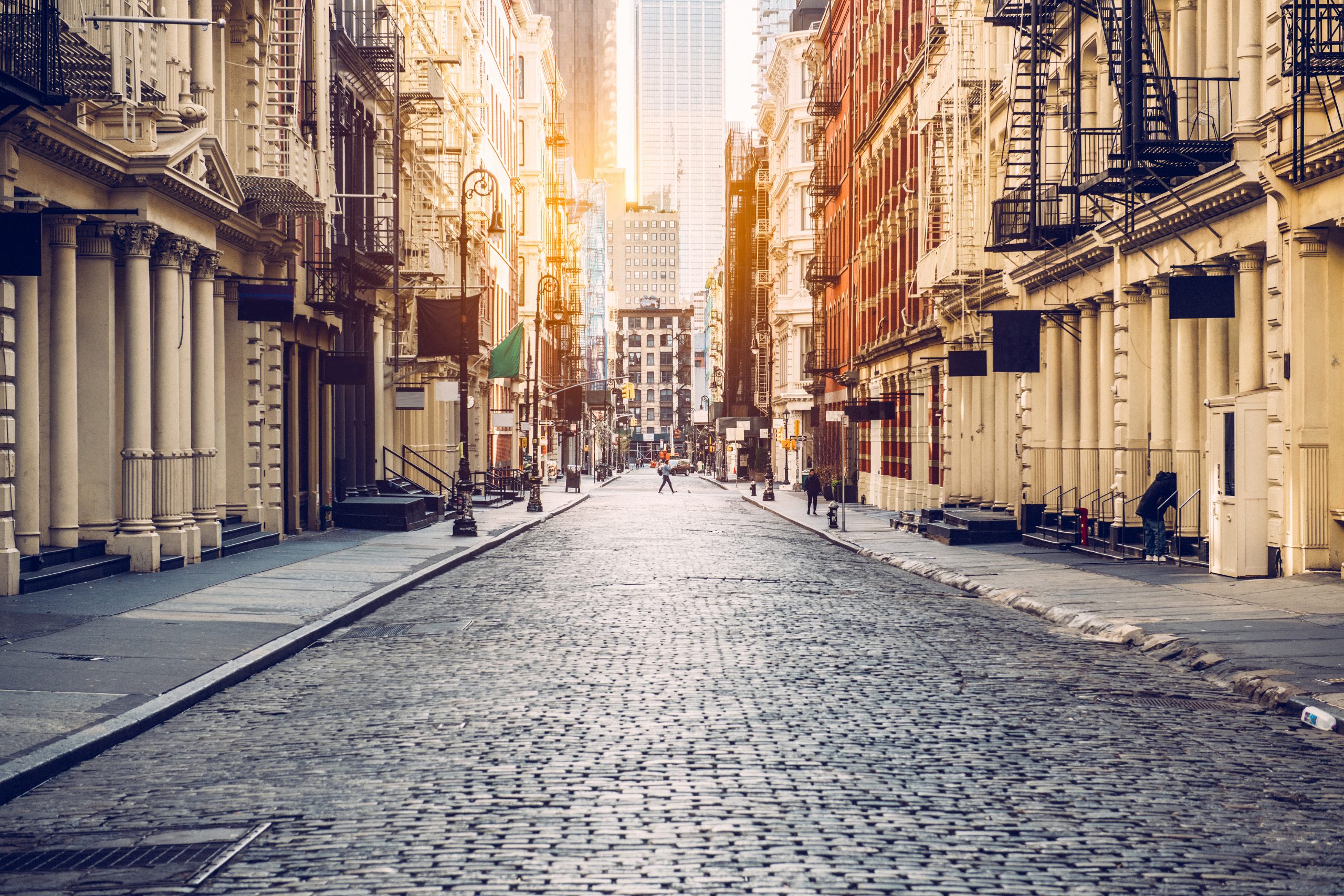 a busy city street at sunset